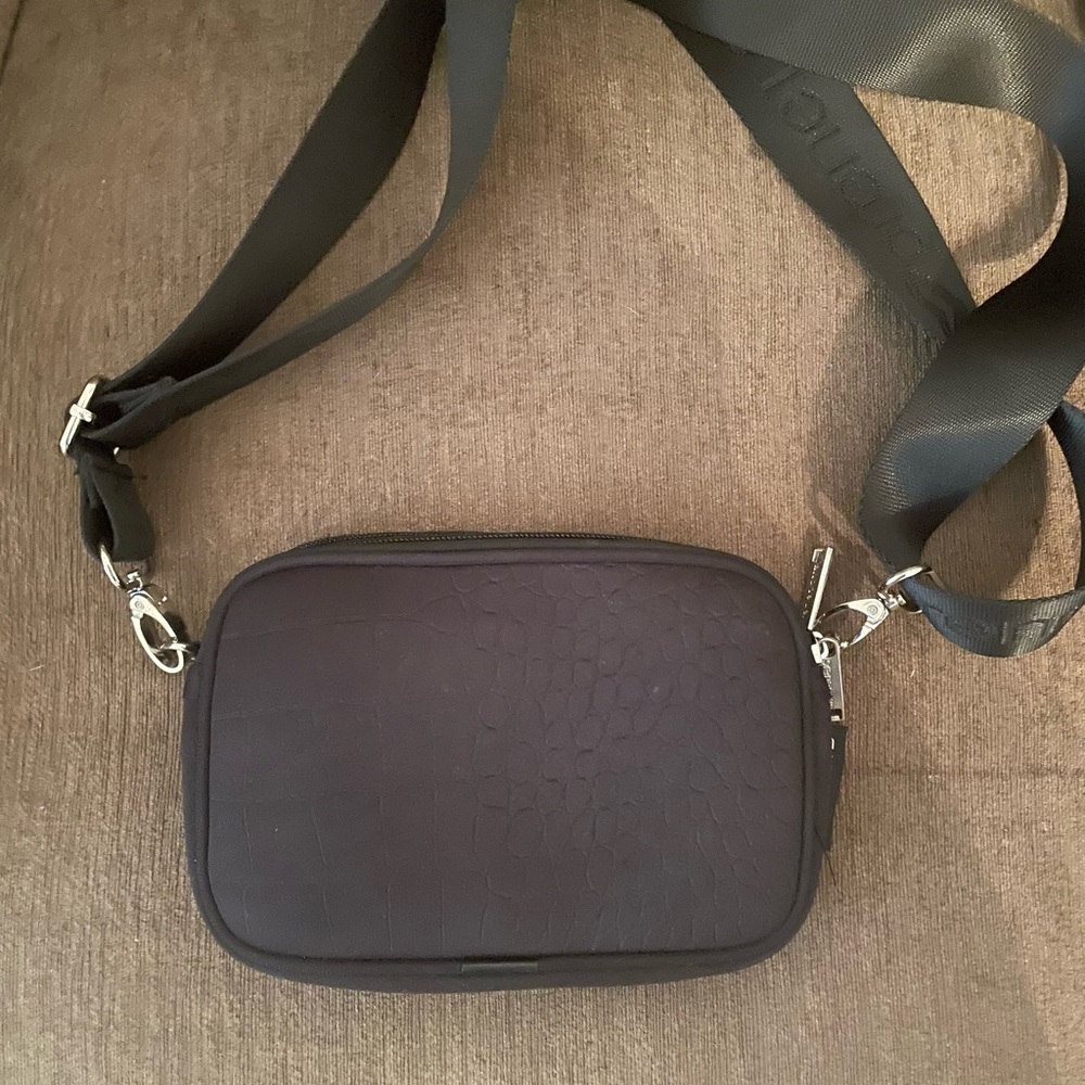 Sleek Black Belt Bag with Adjustable Strap and Structured Finish